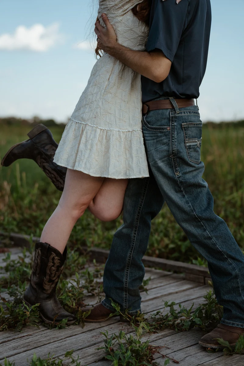Abby and Collin strolling with a happy kicked-up heel
