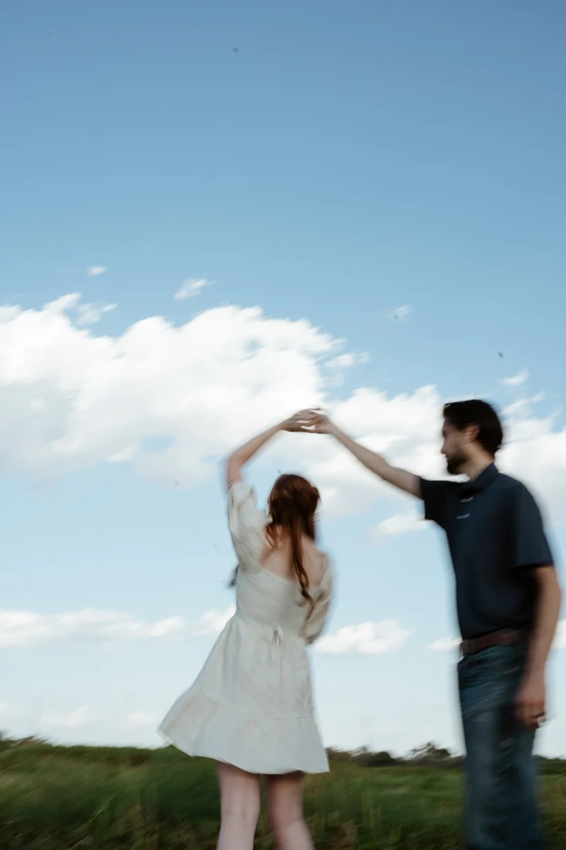 Abby and Collin dancing under a big sky